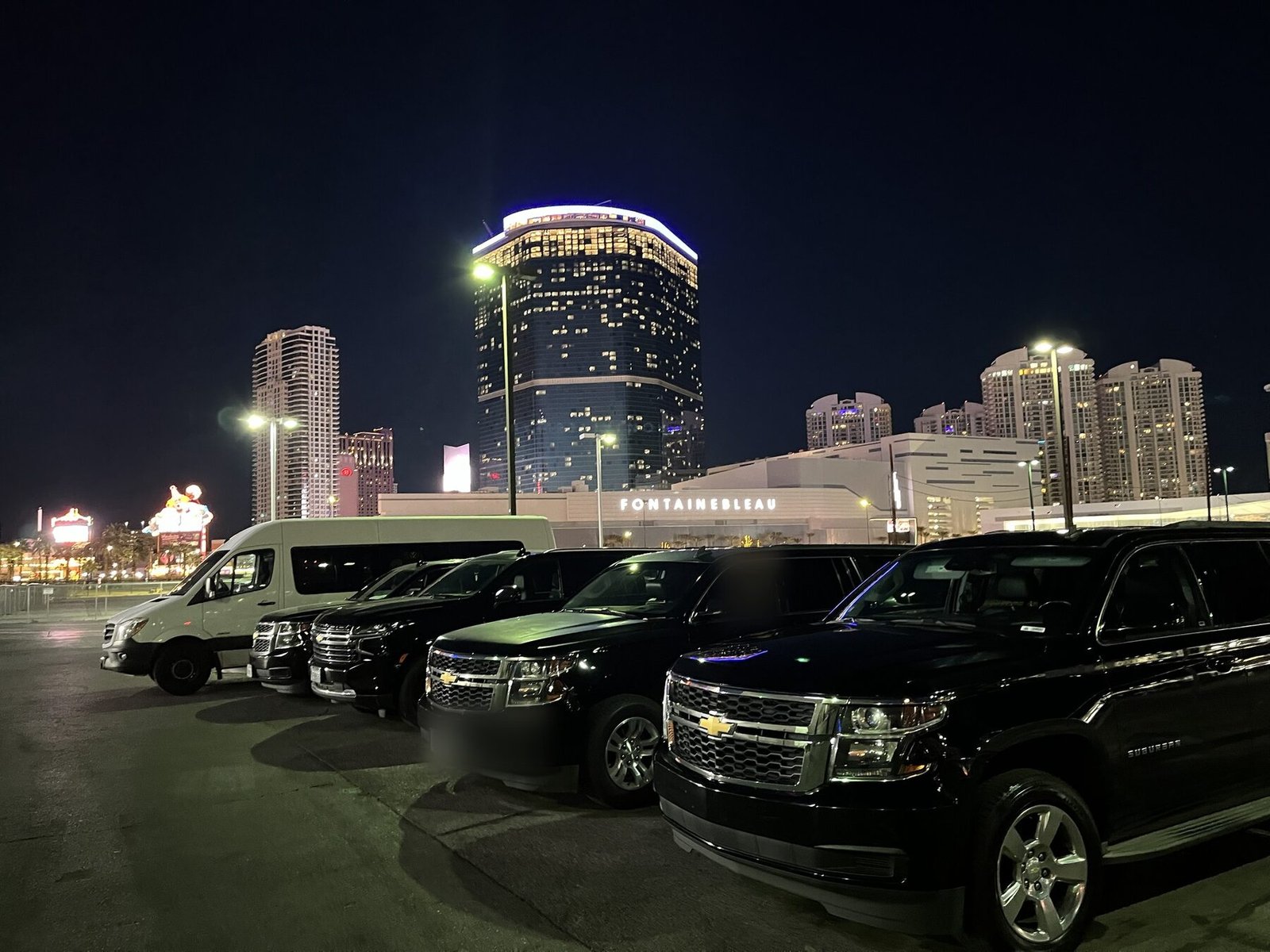 A Blue Skies Chauffeured Transportation fleet lineup at night in Las Vegas